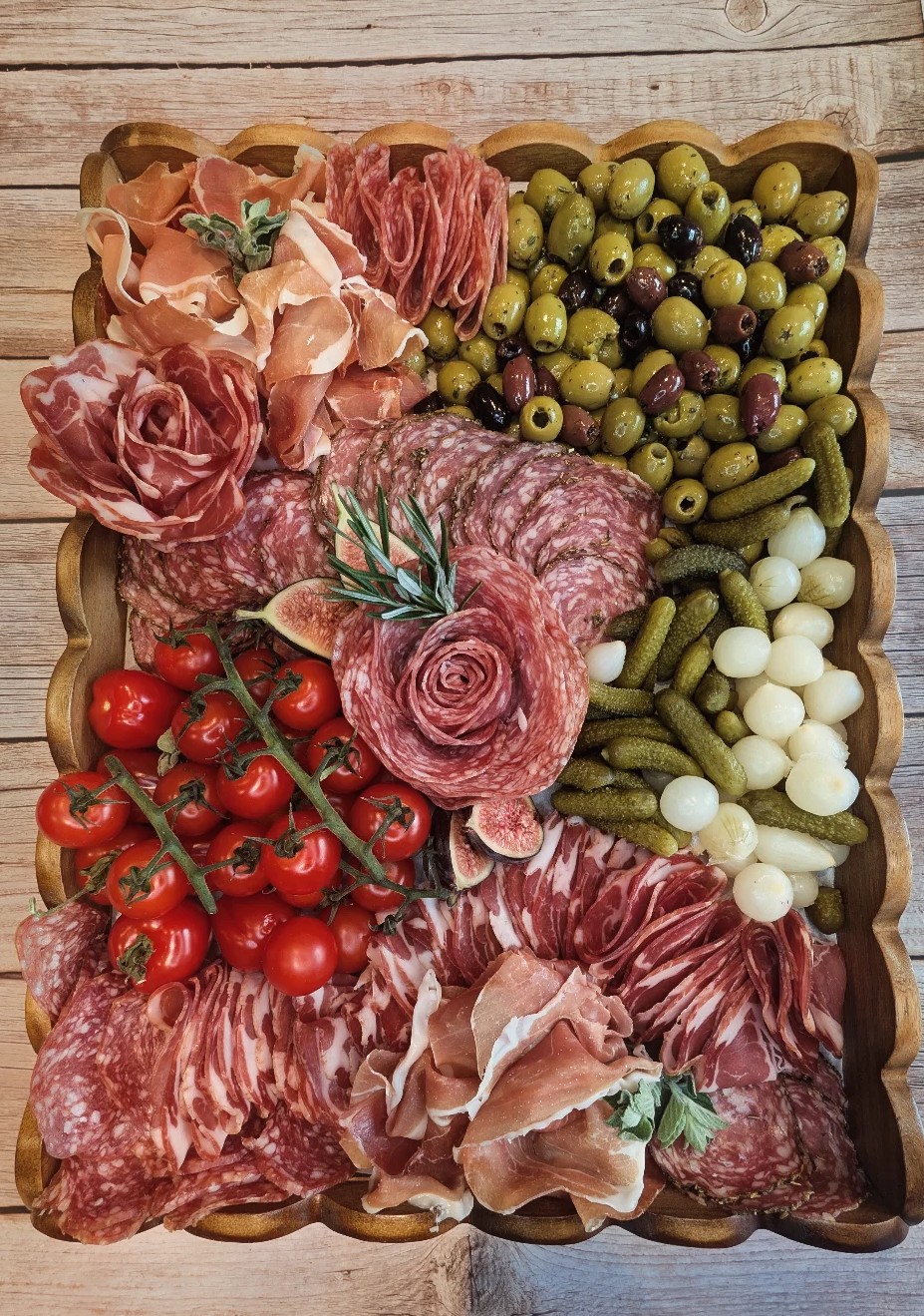 A Fig and Thyme charcuterie platter with salami rose